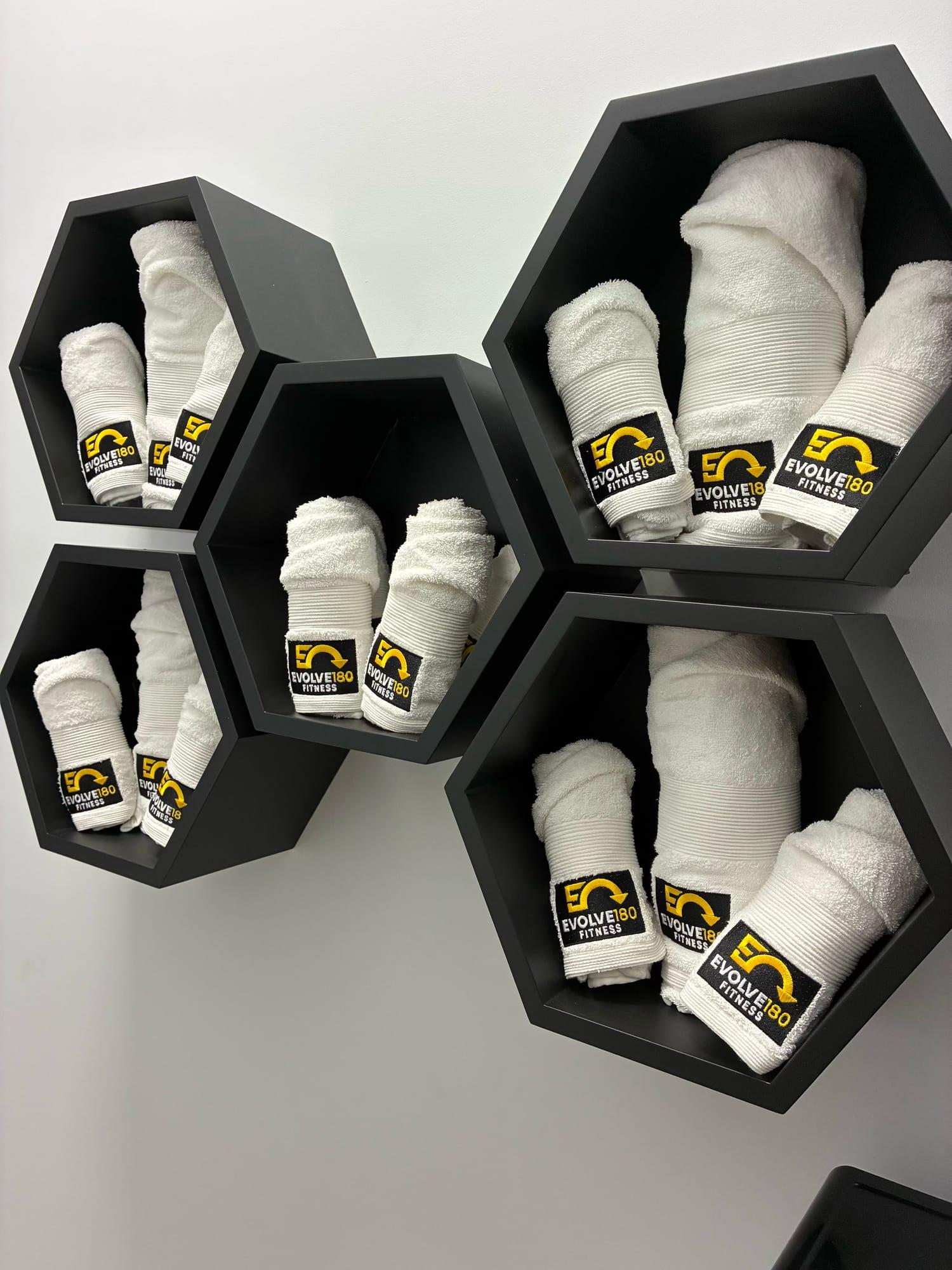 Honeycomb shelves stocked with Evolve180 towels