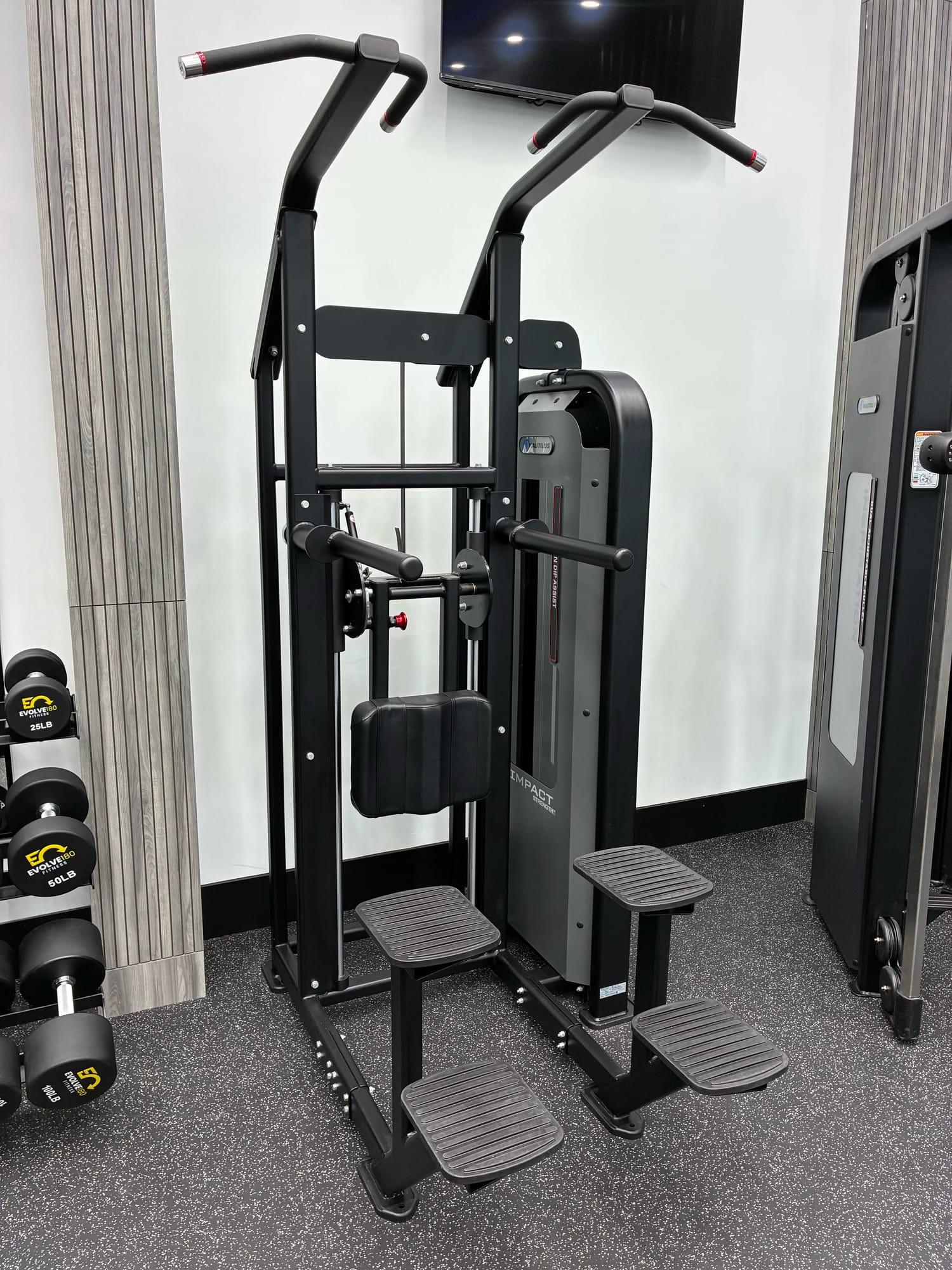 Assisted dip and chin-up machine