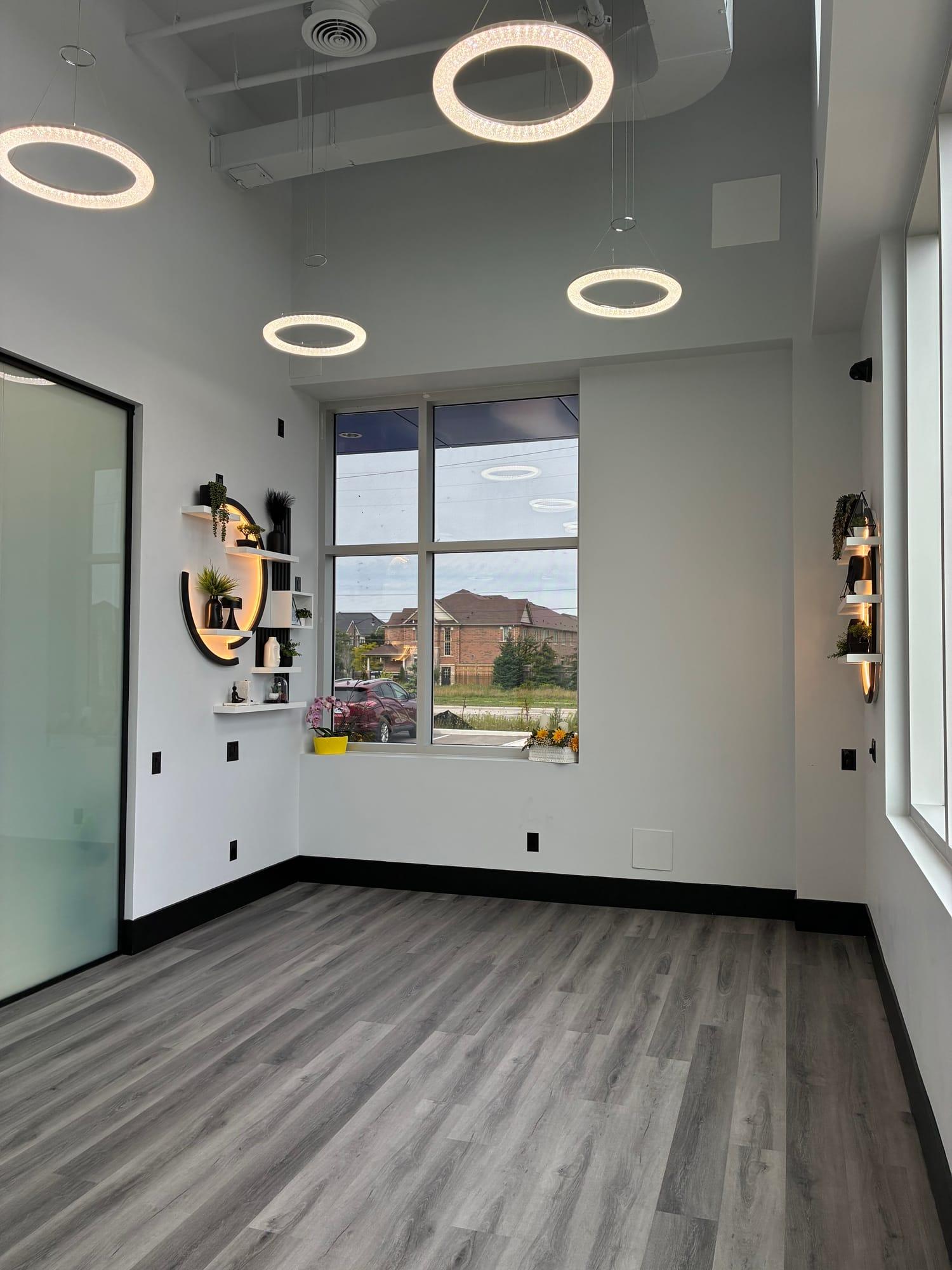 Bright open studio with ring pendant lights